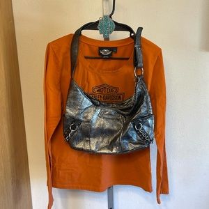 Harley Davidson lot shirt, purse, and turquoise belt buckle